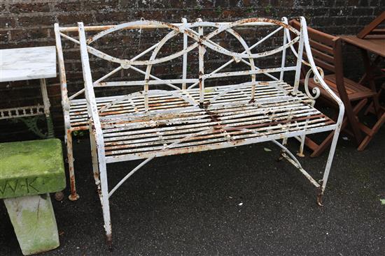 A Regency white painted iron garden bench and one other garden bench